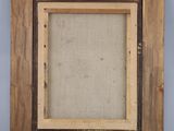 an old picture frame with a picture hanging on the wall