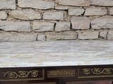 a marble top desk with two drawers on top of it