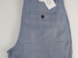 a close up of a pair of blue pants on a white surface