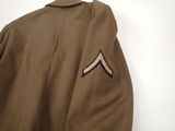 a close up of a uniform jacket with a chevron on it