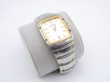an image of a silver and gold watch on a white wrist