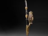 an image of a wooden stick with a bird on it