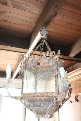 a light hanging from the ceiling in a room