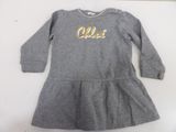 a little girl ' s grey dress with gold letters on it