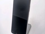 a cell phone that is sitting on top of a stand