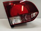 a close up of a red tail light on a white surface