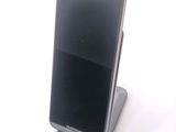 a cell phone that is sitting on top of a stand