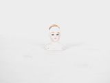 baby doll in the snow with a crown on her head