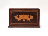 a small wooden box with a design on it