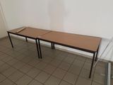 two tables that are sitting in a room