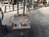 a machine that is sitting on the ground in a garage