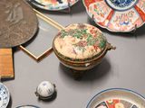 a lot of different plates and bowls on the table