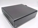 a close up of a black computer on a white surface