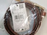 a close up of a brown cord on a white surface