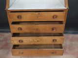 a wooden dresser with a mirror on top of it