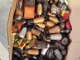 a cardboard box filled with assorted items on the floor