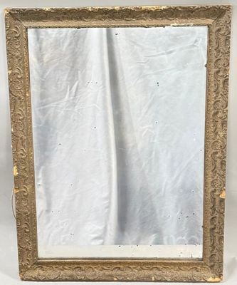 a gold framed mirror with a white background