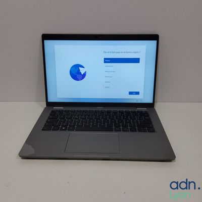 an open laptop computer sitting on top of a white table