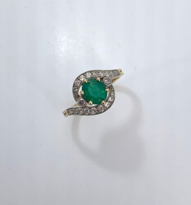 Bague en or jaune et blanc 750°/°°° à deux brins tournoyant …