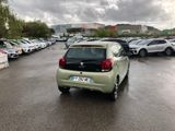 cars parked in a parking lot with a cloudy sky in the background