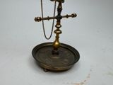 a brass plate with a cross on it on a table