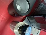two speakers that are sitting on a red table