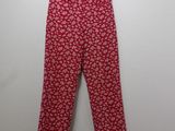 the children ' s red floral pants are hanging on a hanger