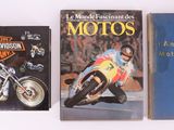 three books on a white surface one is a motorcycle and the other is a motorcycle