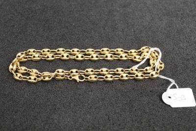 a close up of a gold chain with a tag on it