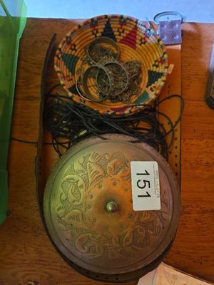 a wooden table with a clock and other items on it