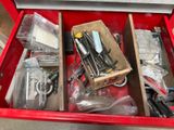 a red box with tools in it on the floor