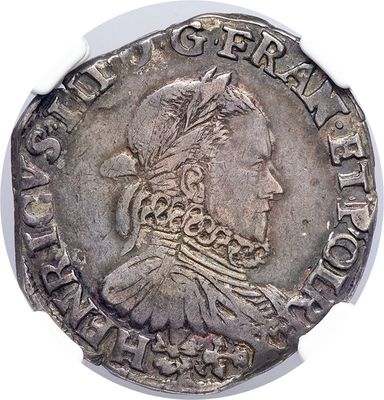 a close up of a silver coin with a woman ' s head on it