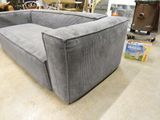 a couch that is sitting in the middle of a room