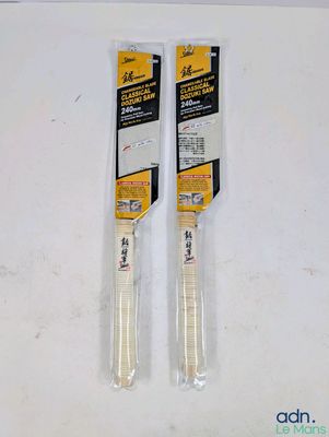pair of two plastic knives sitting on top of a white surface