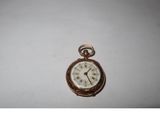 an image of a pocket watch on a white surface
