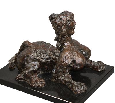 bronze sculpture of a dog and a cat on a marble base