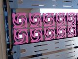 a picture of a computer case with a bunch of pink wires