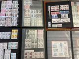 a lot of stamps on display in a display case
