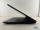 the laptop is sitting on the table with its lid open