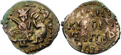 an ancient coin with the image of a dragon on it