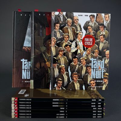 a lot of books that are stacked on top of each other