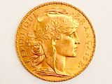 an image of a gold coin with a woman ' s head on it