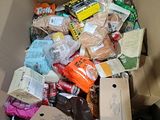 a cardboard box full of food and snacks in it