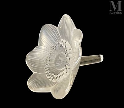 a close up of a glass flower on a black background
