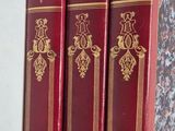three books that are sitting on a shelf next to each other