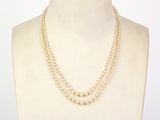 two strand pearl necklaces on a mannequin torso