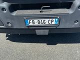 a car that has a license plate on the front of it