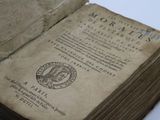 an old book with a picture of a woman on it