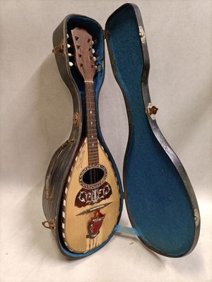 a guitar that is sitting in a case on a table