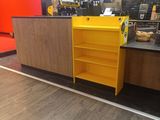 a yellow cabinet in the middle of a store